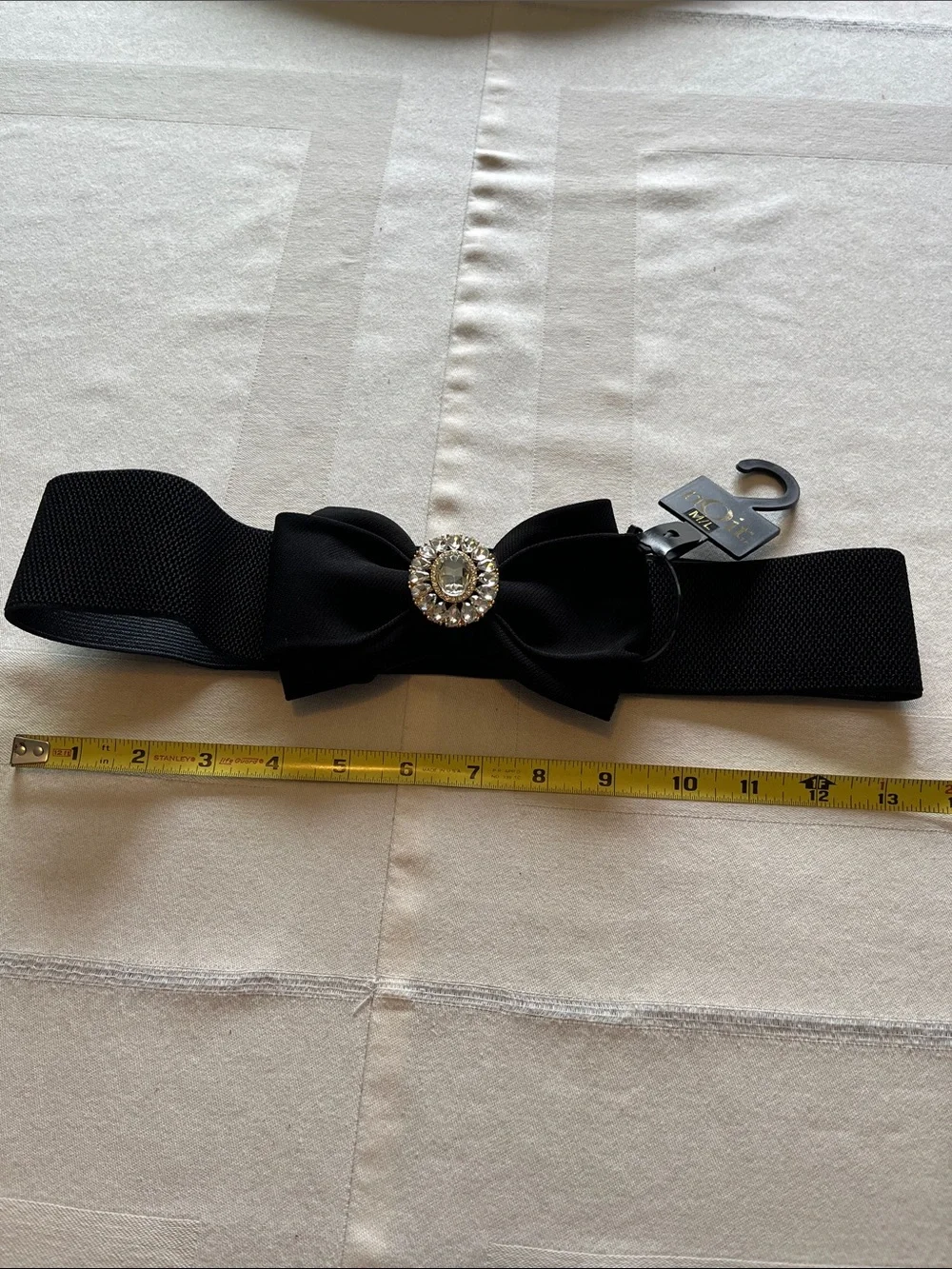 NWT nOir Jewelry Black Bow Elastic Waist Belt with Crystal Medallion Size M/L